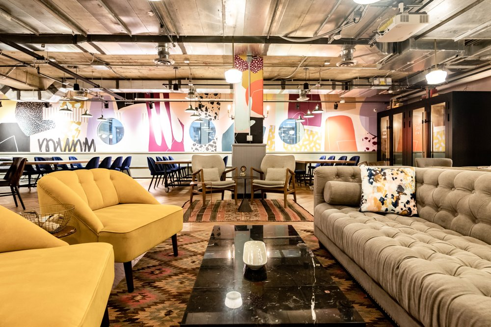 Warm communal lounge with curated seating